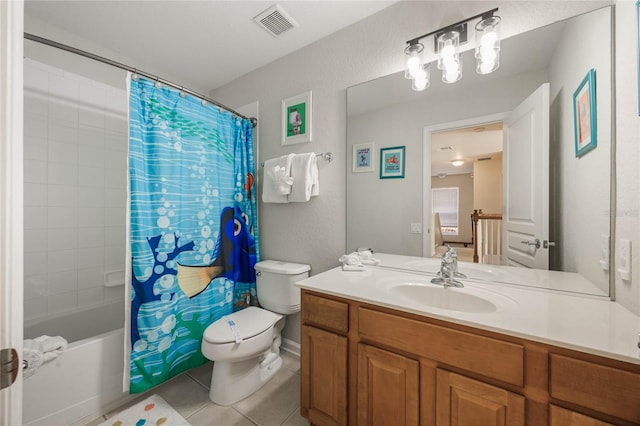 full bathroom with vanity, toilet, shower / bath combo with shower curtain, and tile patterned flooring