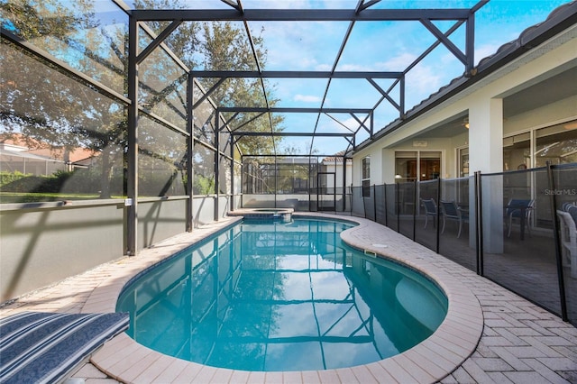 view of swimming pool with a patio and glass enclosure