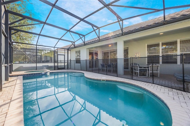 view of swimming pool with a patio and a lanai