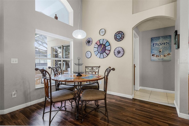 dining area with dark hardwood / wood-style flooring