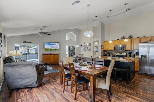 dining room featuring ceiling fan, high vaulted ceiling, and dark hardwood / wood-style flooring