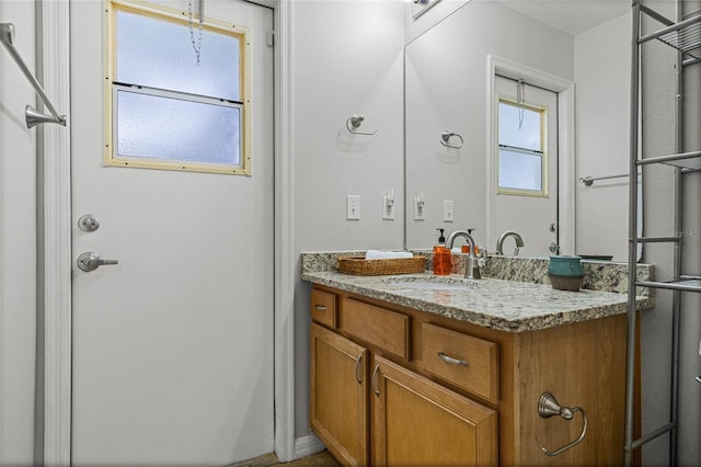 bathroom featuring vanity and plenty of natural light