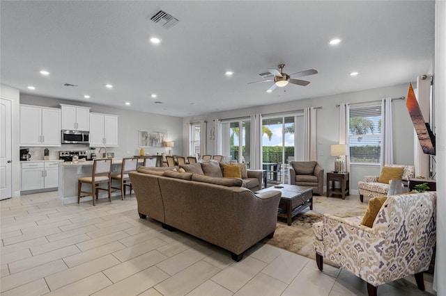 living room featuring ceiling fan