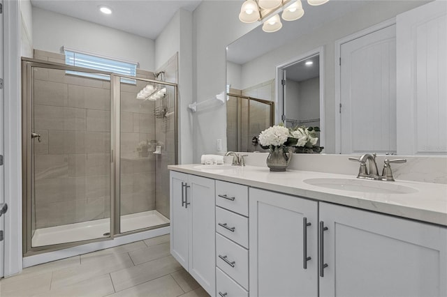 bathroom featuring vanity, tile patterned floors, and an enclosed shower