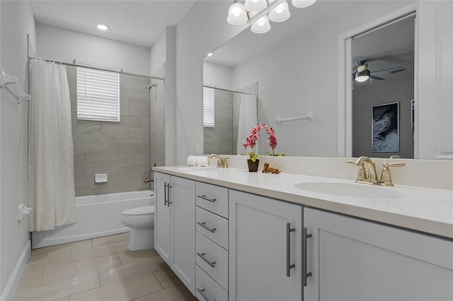 full bathroom with toilet, ceiling fan, vanity, shower / tub combo with curtain, and tile patterned flooring