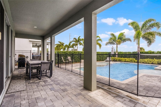 view of swimming pool featuring a patio and an in ground hot tub