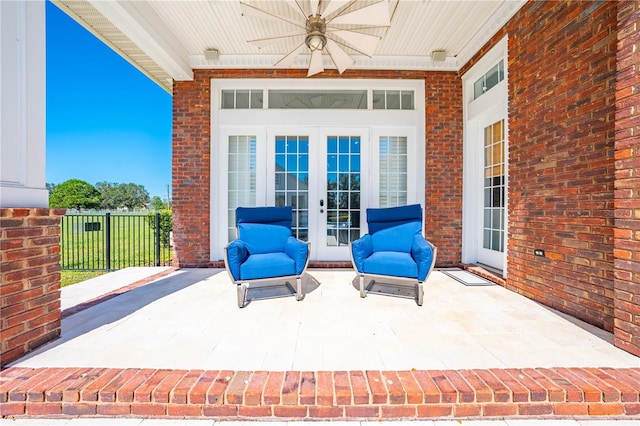 view of patio featuring french doors and ceiling fan