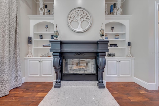 interior details with built in features and wood-type flooring