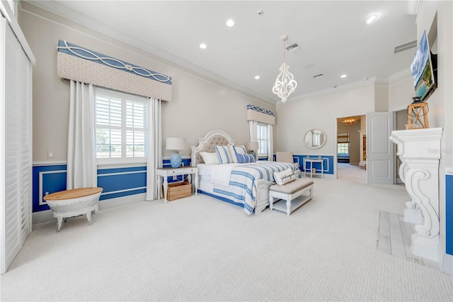 bedroom featuring carpet flooring, crown molding, and an inviting chandelier