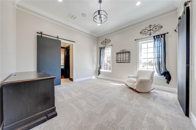 living area with a barn door, carpet, and ornamental molding