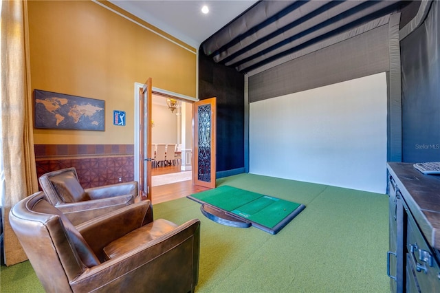 interior space featuring golf simulator and carpet flooring