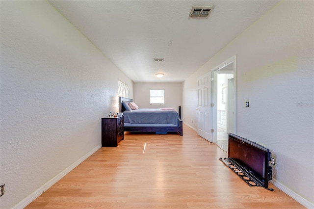 bedroom with light hardwood / wood-style flooring