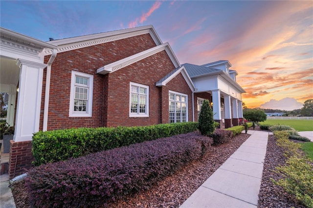 view of property exterior at dusk