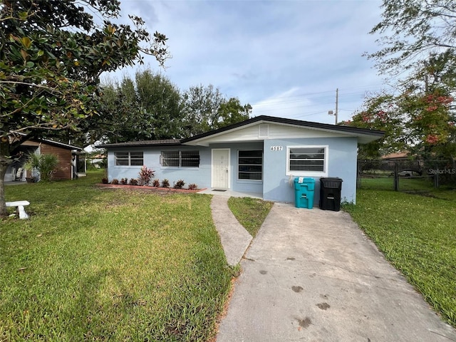 ranch-style home with a front yard