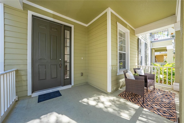 entrance to property featuring a porch