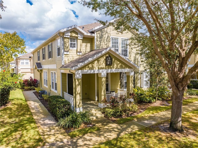 view of front of property with covered porch and cooling unit