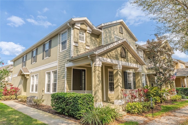 view of property exterior with covered porch and central air condition unit