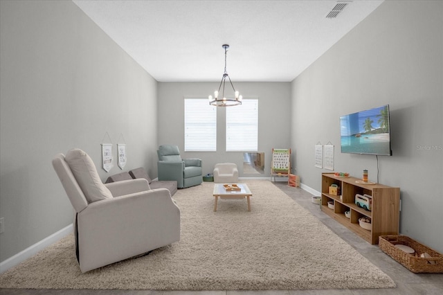 living room featuring an inviting chandelier