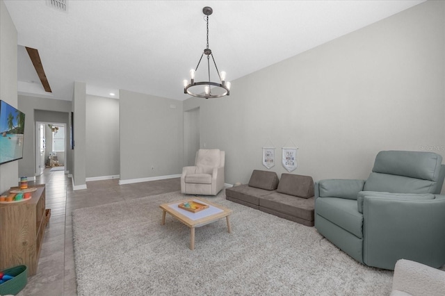 living room with tile patterned floors and a chandelier