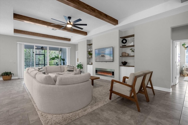 living room with ceiling fan, tile patterned floors, and beam ceiling