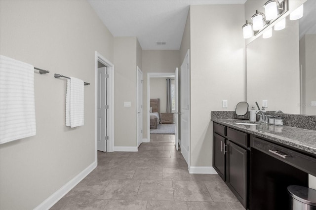 bathroom with vanity and tile patterned floors