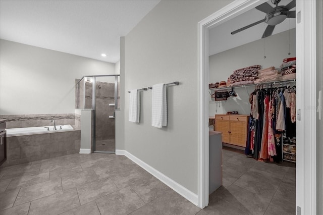 bathroom featuring ceiling fan, tile patterned flooring, and plus walk in shower