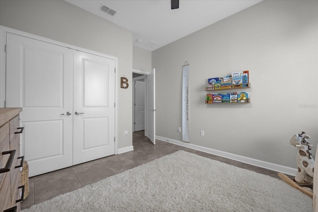 unfurnished bedroom with a closet and light tile patterned floors