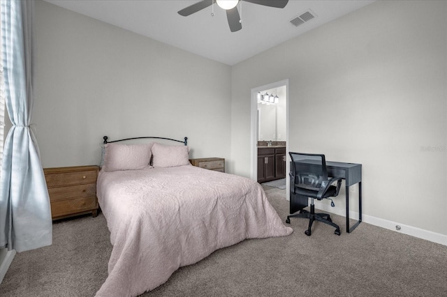 bedroom featuring connected bathroom, ceiling fan, and light carpet