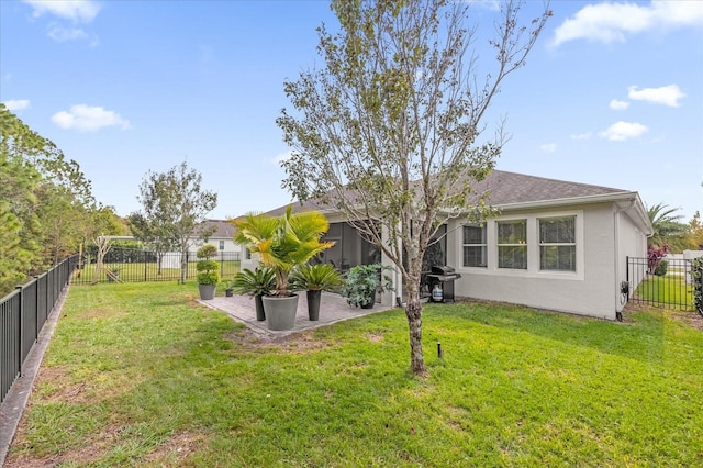 rear view of house featuring a lawn