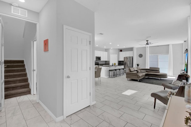 living room with ceiling fan