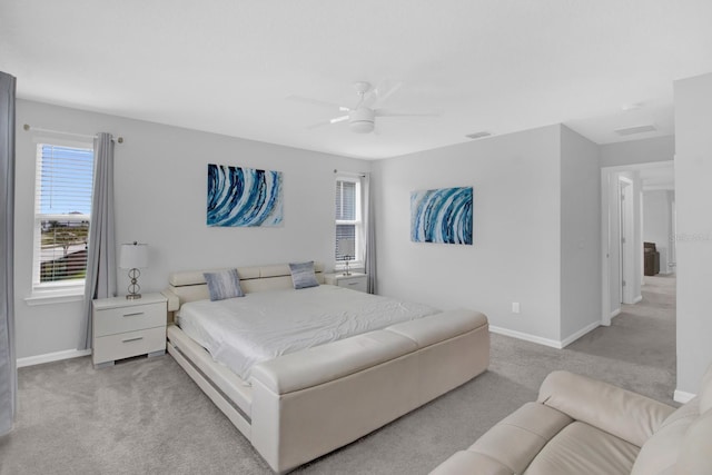 bedroom featuring light carpet and ceiling fan