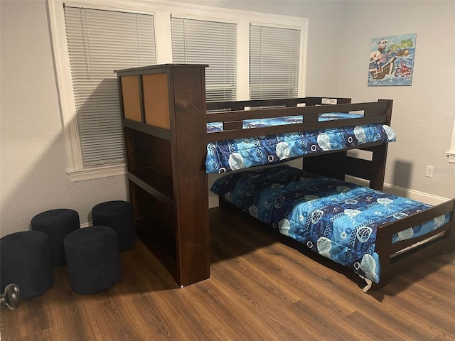 bedroom with wood-type flooring