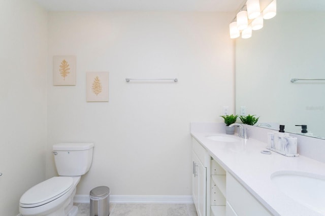 bathroom featuring vanity, toilet, and tile patterned flooring