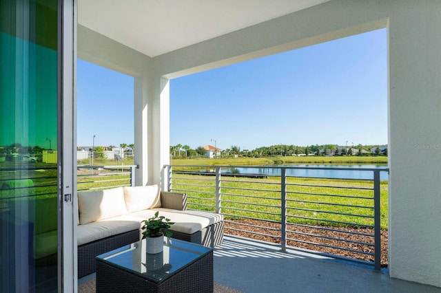 balcony featuring a water view