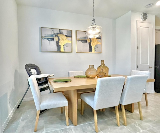 dining room with baseboards