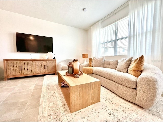 living area featuring light tile patterned flooring