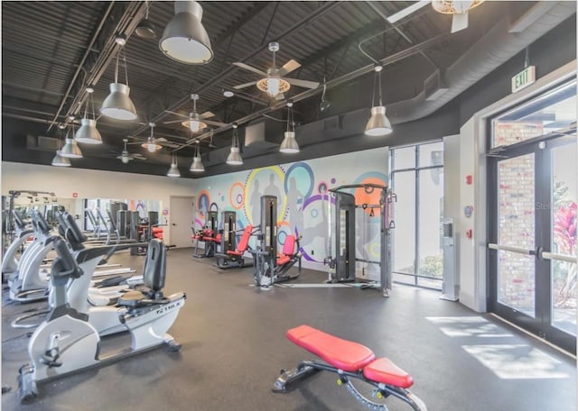 exercise room featuring french doors, rail lighting, and ceiling fan