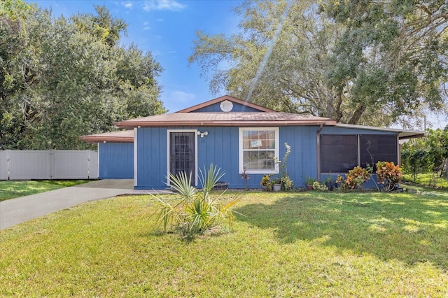 ranch-style home featuring a front yard