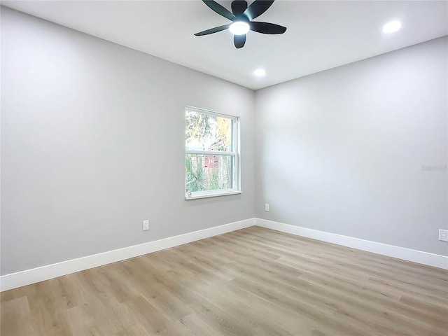 unfurnished room with ceiling fan and light hardwood / wood-style flooring