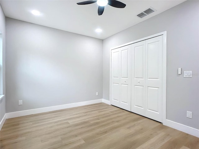 unfurnished bedroom featuring a closet, ceiling fan, and light hardwood / wood-style floors