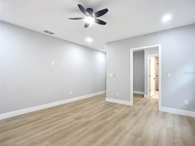 unfurnished room with ceiling fan and light wood-type flooring