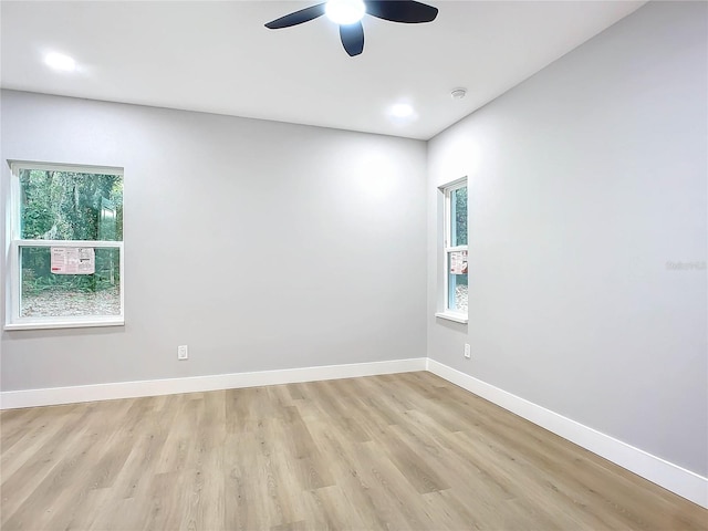 spare room featuring ceiling fan and light wood-type flooring