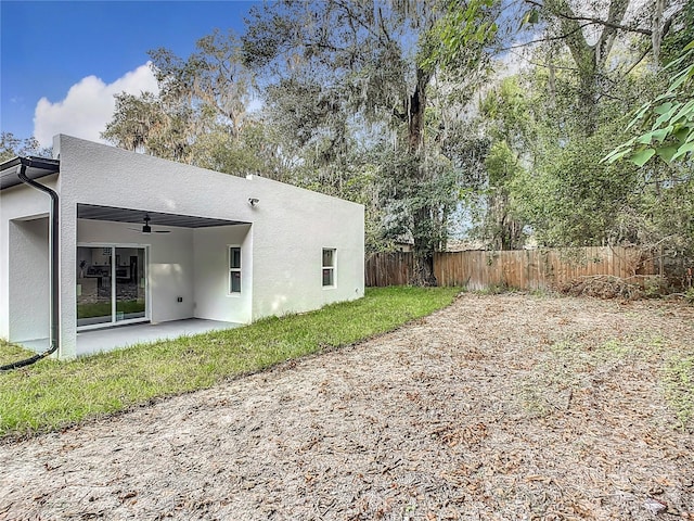 back of house with a patio and ceiling fan