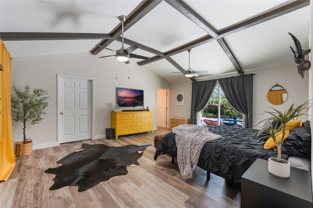 bedroom with hardwood / wood-style flooring, ceiling fan, and lofted ceiling with beams