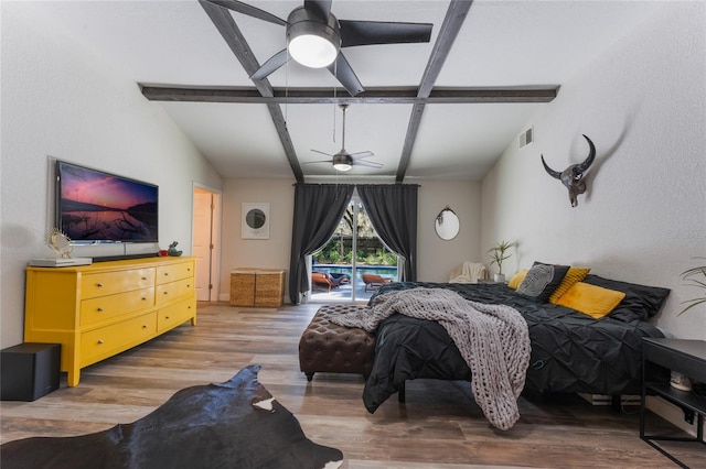 bedroom with lofted ceiling with beams, wood-type flooring, and ceiling fan