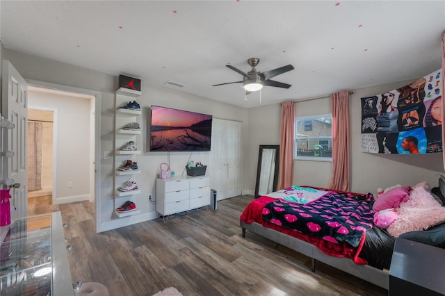 bedroom with hardwood / wood-style floors and ceiling fan