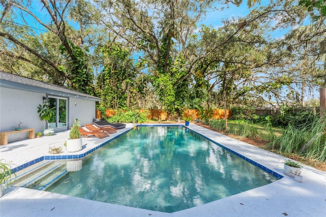 view of swimming pool with a patio area