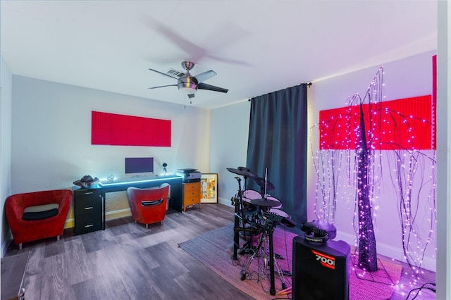 home office featuring dark wood-type flooring and ceiling fan