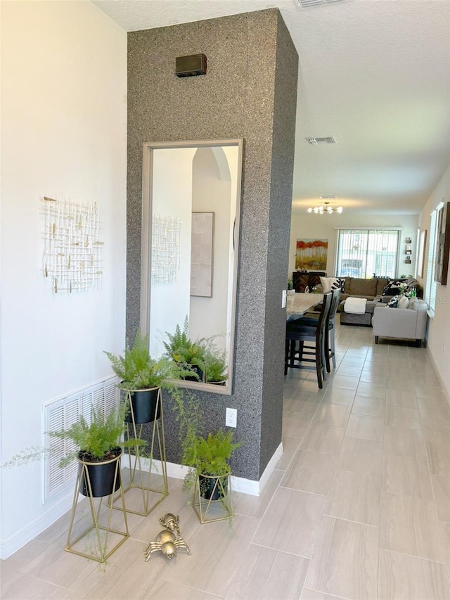 corridor with tile patterned flooring