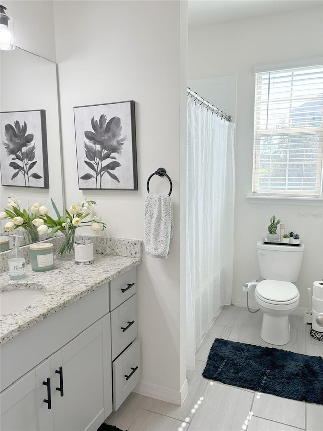 full bathroom featuring toilet, vanity, shower / bath combination with curtain, and tile patterned flooring